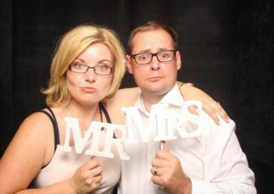 Married couple pose in the phot booth - Funbooth Photo Booth Hire for weddings